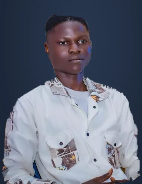 Portrait of Muhammed Olalekan wearing a cream patterned shirt